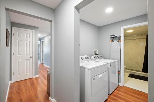a bathroom with a white sink and a walk in shower at Sensation on Salisbury in Pittsburgh