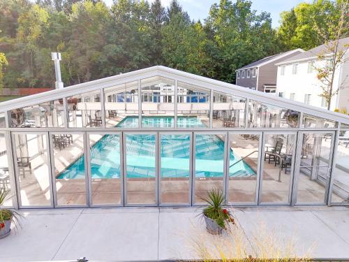 an image of a pool house with glass walls at Spacious Dog-Friendly Getaway with Year-Round Pool & Hot Tub in South Haven