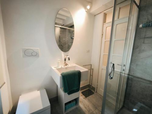 a bathroom with a sink and a mirror at Sassoverde 9 in Arezzo