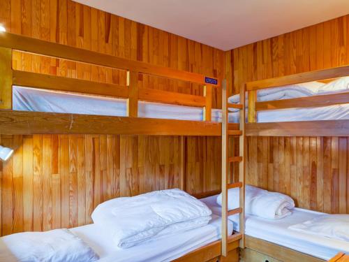 a bunk bed room with three bunk beds in it at Appartement 2 pièces avec balcon au coeur de Courchevel 1550, proche des pistes et commerces - FR-1-514-7 in Courchevel