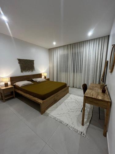 Llit o llits en una habitació de Charmant appartement