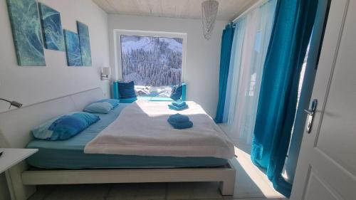 Ένα ή περισσότερα κρεβάτια σε δωμάτιο στο Blue Mountain Suite