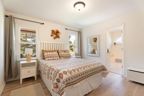 a white bedroom with a bed and a window at Meadow Farm in Holly Springs, NC in Holly Springs