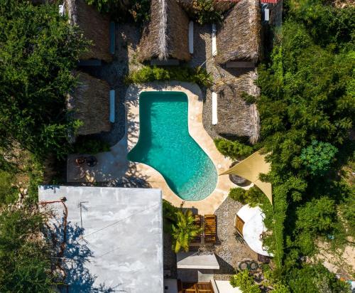 an overhead view of a swimming pool in a resort at Villa Privada Merkaba Pxm in Brisas de Zicatela