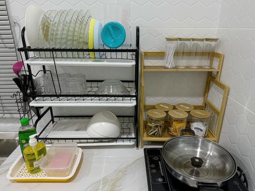 a kitchen counter with a sink and some dishes at Lunavista Homestay Jitra in Jitra