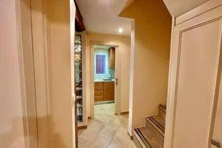 a hallway of a home with a kitchen and a bathroom at Kai Etxea , el mismo puerto de Bermeo in Bermeo