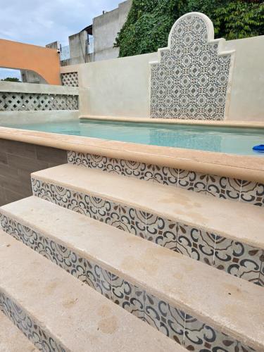 a set of stairs with a pattern on them at Hotel Casa Henequén in Valladolid