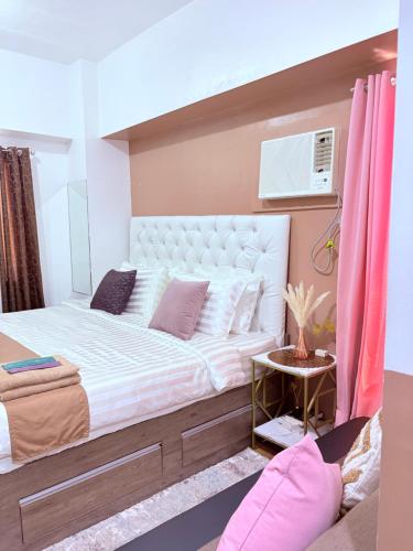 Letto o letti in una camera di Sunvida tower SM cebu