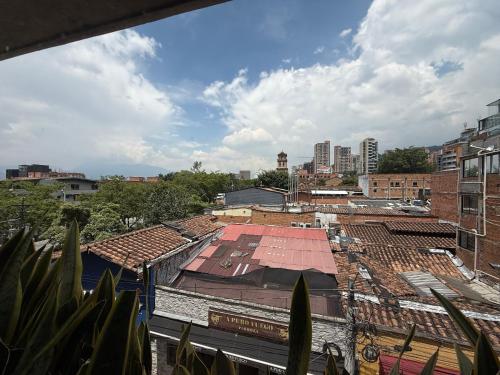 an overhead view of a city with buildings and roofs at 3 bedroom apartment, with arcade machine - 1 block from lleras park p7 in Medellín