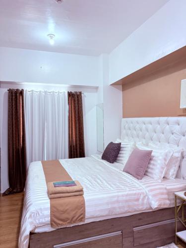 Letto o letti in una camera di Sunvida tower SM cebu