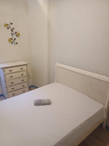 Ένα ή περισσότερα κρεβάτια σε δωμάτιο στο Casinha Indira Centro Histórico