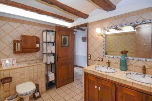 a bathroom with two sinks and a mirror at Marina Vila House, Vista Playa in El Masnou