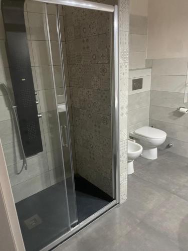 a bathroom with a shower and a toilet at Vista Vittorio Veneto in Follonica