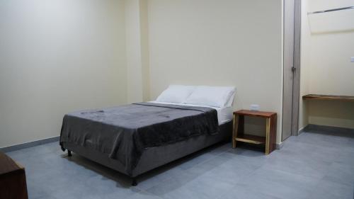 Ένα ή περισσότερα κρεβάτια σε δωμάτιο στο Nómada Private Rooms - Near Santa Marta Center