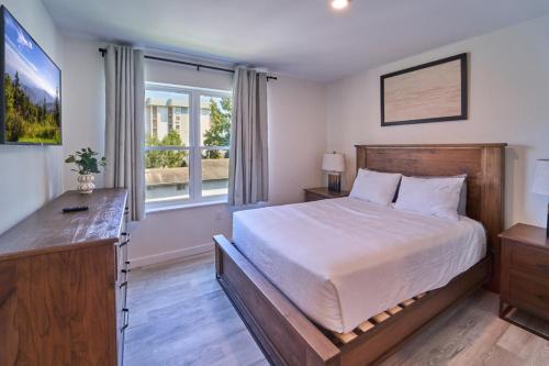a bedroom with a large bed and a window at The Ruby 301 By Avada Properties in Pigeon Forge