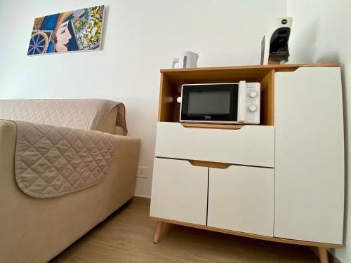 TV a/nebo společenská místnost v ubytování Nicuzza Apartment