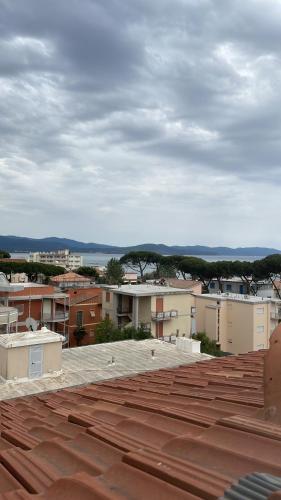 a view of a city from the roof of a building at Lovely apartment near the beach in Follonica