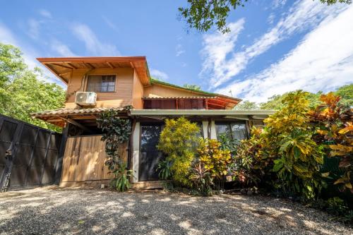 an exterior view of a house with a fence at Casa Playa Avellanas in Santa Cruz