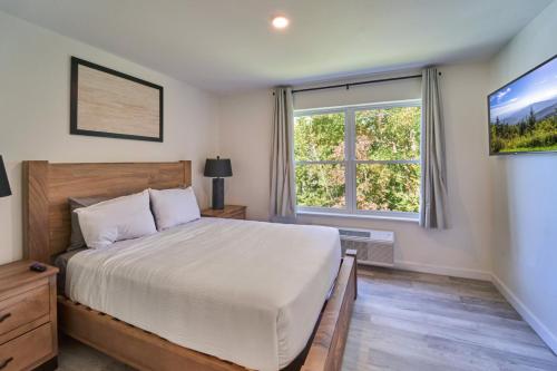 a bedroom with a bed and a large window at The Ruby 311 By Avada Properties in Pigeon Forge