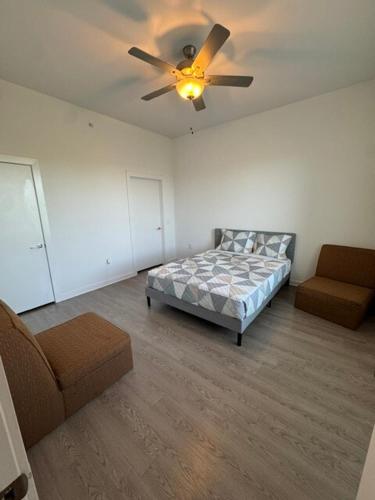 a bedroom with a bed and a ceiling fan at New 1BR Apt leander tx in Leander