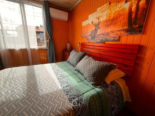 Postel nebo postele na pokoji v ubytování HOSTAL VALDIVIA