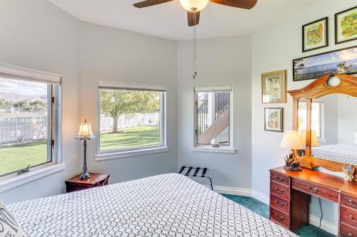 a bedroom with a bed and two windows at Under the Sea and Ski Apt with View, Near Dwtn in Salt Lake City