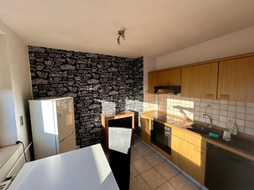 Kuchyň nebo kuchyňský kout v ubytování Schubert Apartment