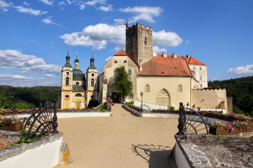 an old building with a tower on top of it at Cyklochata in Vranov nad Dyjí