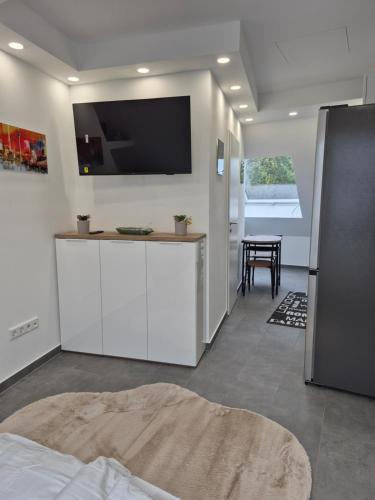 TV a/nebo společenská místnost v ubytování MG Studio