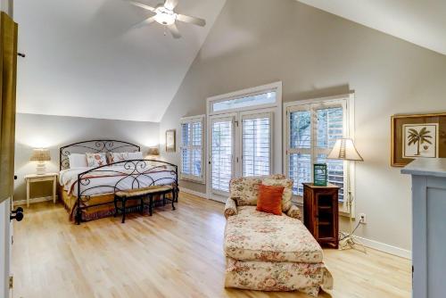 a bedroom with a bed and a couch and a chair at SM08: 8 Silver Moss in Kiawah Island