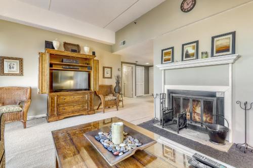 a living room with a fireplace and a tv at Sugar Top 2105 in Sugar Mountain