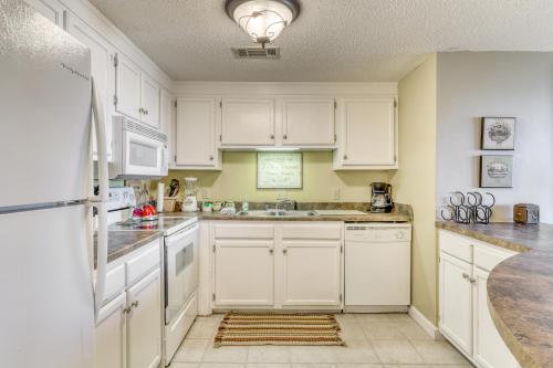 a kitchen with white cabinets and a sink at Sugar Top 2105 in Sugar Mountain