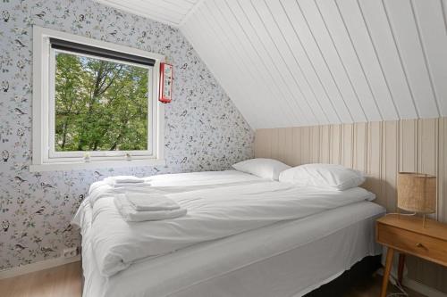 En eller flere senge i et værelse på Urban and stylish apartment in city centre