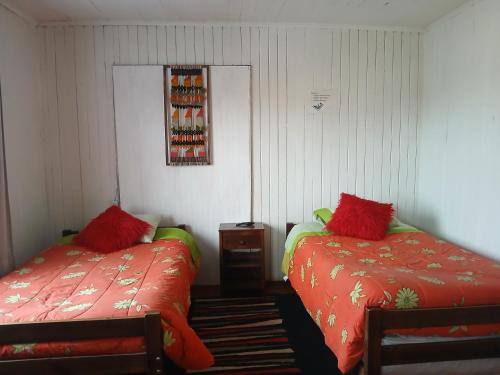 Giường trong phòng chung tại Hospedaje Luna