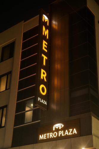 a hotel sign on the side of a building at Hotel Metro Plaza Near New Delhi Railway Station and RK Ashram Metro Station in New Delhi