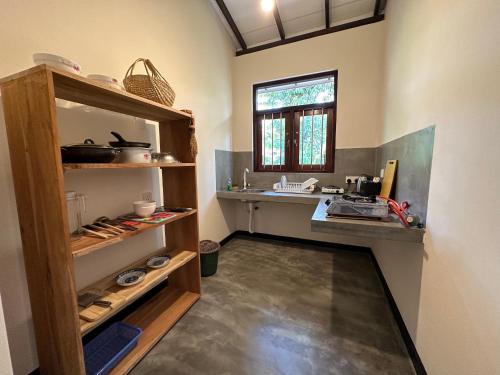 a kitchen with a counter and a sink in a room at Surfside Paddy Villa in Babarenda Central