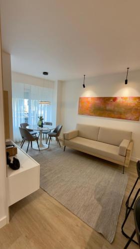 a living room with a couch and a table at Timeless - O`Clock in Lisbon