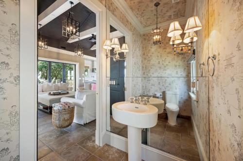 a bathroom with a sink and a toilet at AV9-02: 9 2nd Avenue in Isle of Palms
