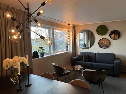 a living room with a table and a couch at g-Suites in Tromsø