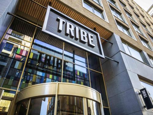 a hotel sign on the side of a building at Tribe Amsterdam City in Amsterdam