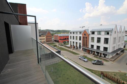 a balcony with a view of a city with buildings at Lovely Flat with Great Central Location Kaunas in Kaunas