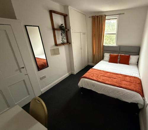a small bedroom with a bed and a window at Saint Paul 04 in Bristol