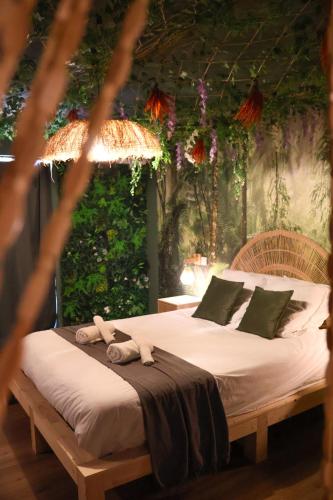 a bedroom with a bed with towels on it at Suite Mahé in Port-de-Bouc