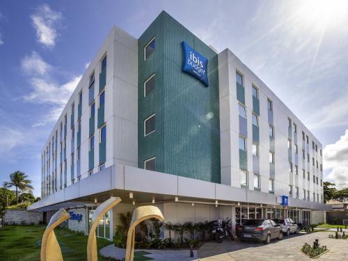 a hotel with a sign on the front of it at ibis budget Recife Jaboatão in Recife