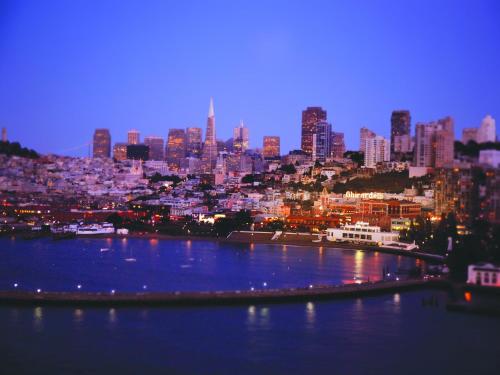 a view of a city at night with a river at The Fairmont Heritage Place Ghirardelli Square in San Francisco