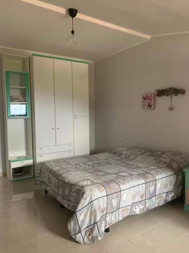 a bedroom with a bed and a ceiling fan at AL Castello in Melfi