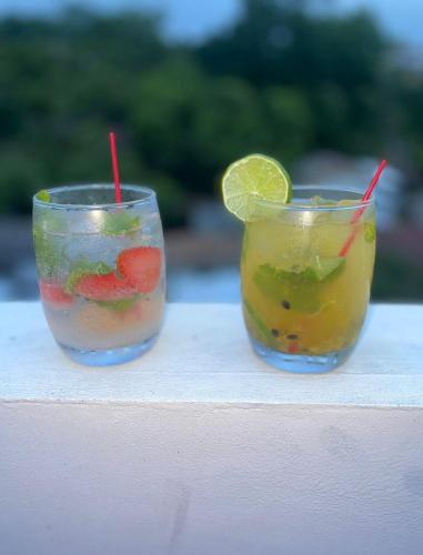 two cocktails sitting on top of a table at Hotel Boutique las Colinas in San José de Colinas