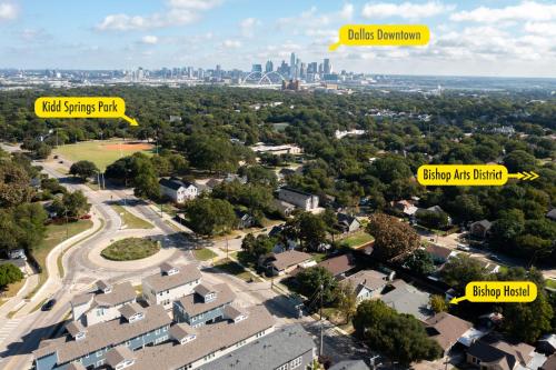 arial view of a neighborhood with a city in the background at Bishop Hostel in Dallas