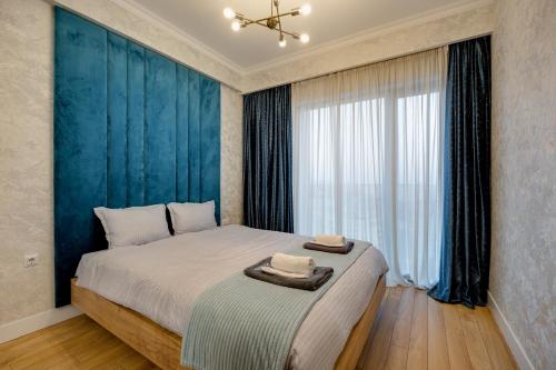 Postel nebo postele na pokoji v ubytování Hilton Suite Apartment Tbilisi