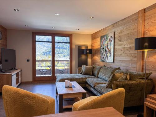 Μια τηλεόραση ή/και κέντρο ψυχαγωγίας στο Appartement écureuil 8 personnes